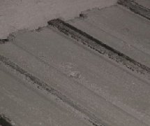 麻豆传煤一区免费入站口砌块生产线的刮浆装置